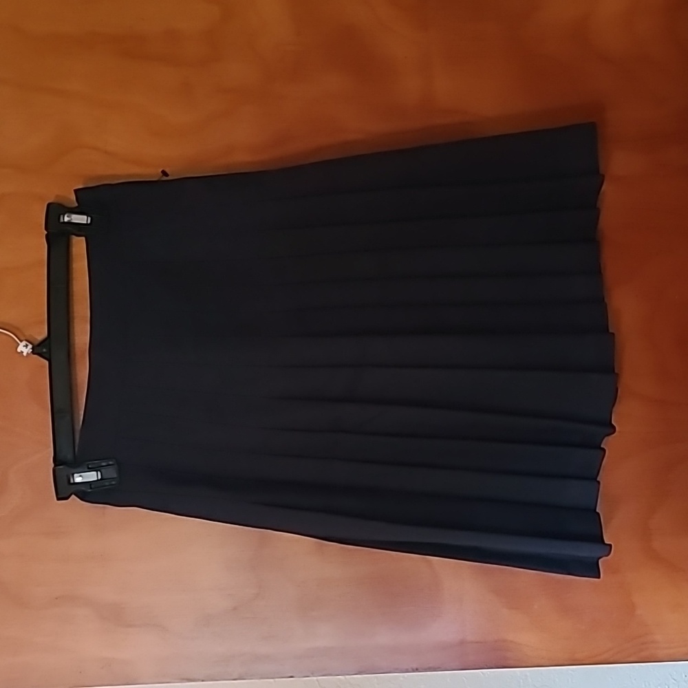 Navy pleated uniform skirt. Size 10 children's. 20 inch long. New